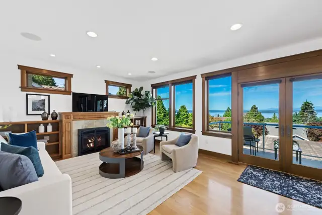 Living room has built in bookshelves and gas fireplace.
