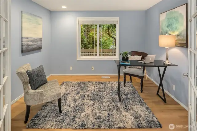 French doors lead to dedicated office space, set away from noise and commotion of kitchen and family room