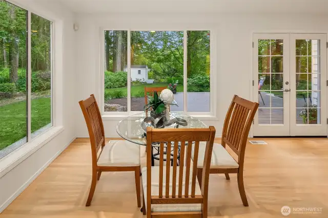 Huge casual dining space , enormous windows flood the space with light