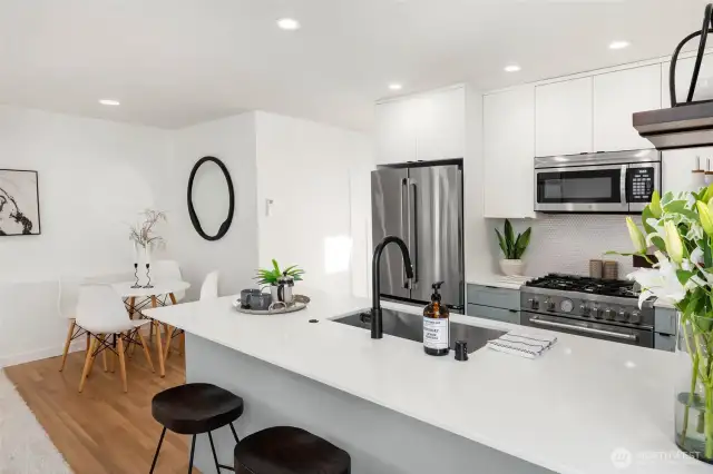 Open-concept kitchen, outfitted with premium appliances