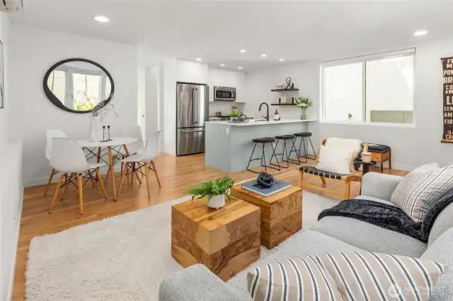 Main floor living flows to a spacious, fully fenced yard with peak views of the Sound