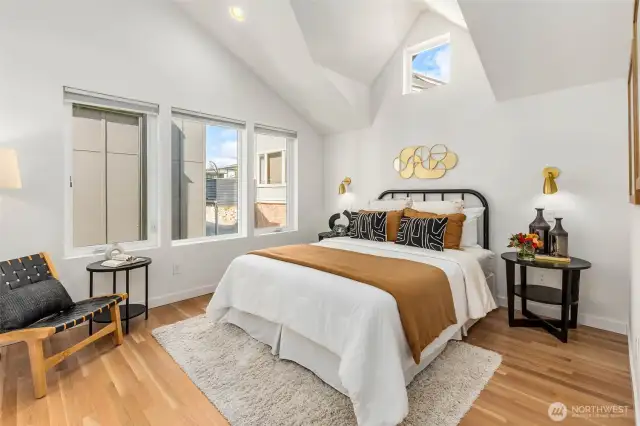 Serene primary suite with vaulted ceilings and a large closet