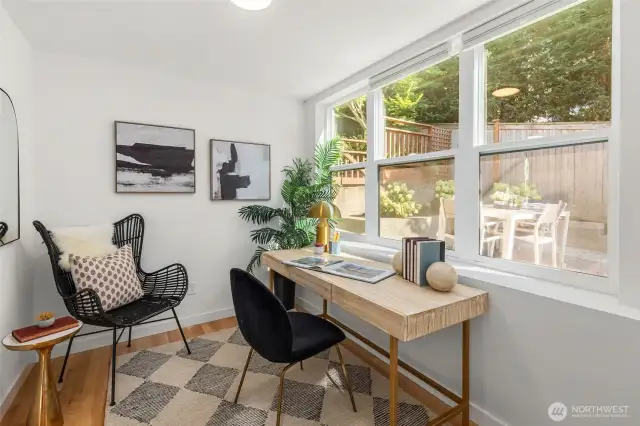 Main level bedroom/office overlooking large fenced yard