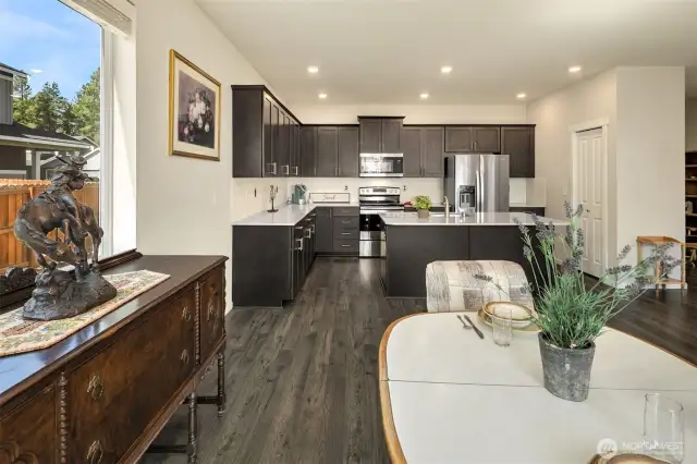 This gorgeous DR Horton resale (2020 build) is sparkly clean and ready for you to move in! Great open concept living, dining and kitchen area with large kitchen island (seats 3 bar stools easily), stainless appliances, ample cabinetry and a nice sized pantry off to the right of the island.