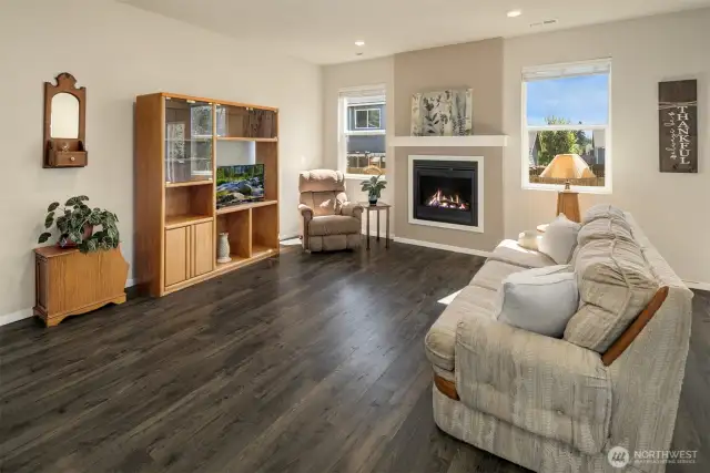 Living room, light, bright and airy. Home has forced air heating and air conditioning to keep you comfy all year around. Snuggle up in front of the gas fireplace on a chilly fall eve with a good book.