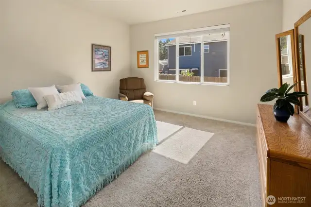 Spacious primary bedroom with en-suite bath and walk in closet