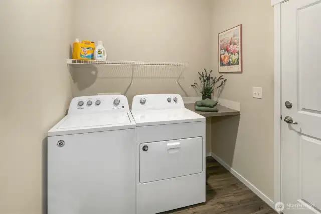 Laundry room with door leading to garage