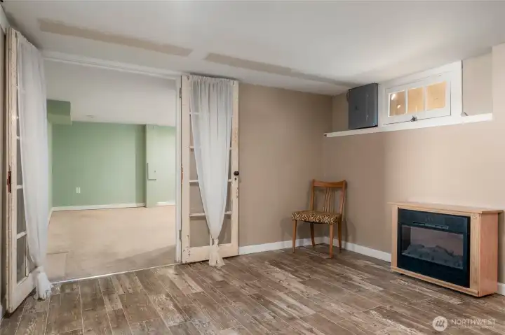 French doors invite you to the 3rd bedroom from basement bonus room