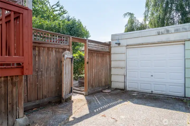 1 car garage down shared driveway