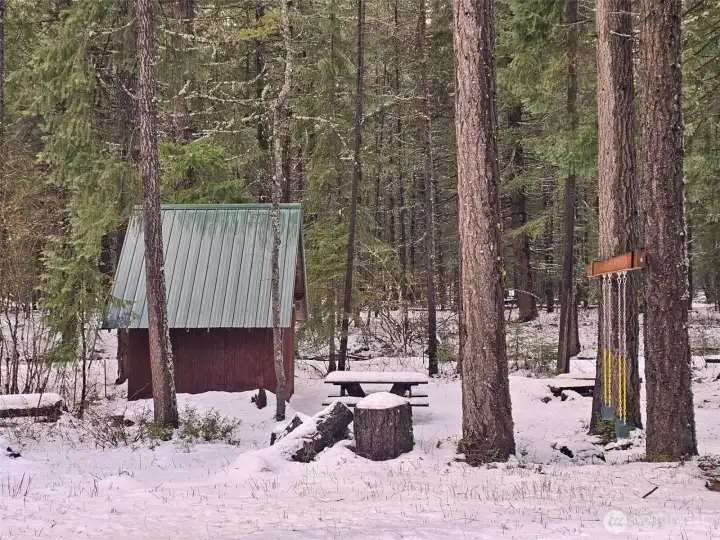 Perfect for year around recreation. Swings, picnic table and a wonderful storage shed for all your toys, Silver Creek runs right behind this shed.