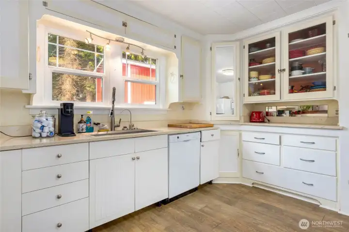 county kitchen with quartz countertops and Bosh appliances