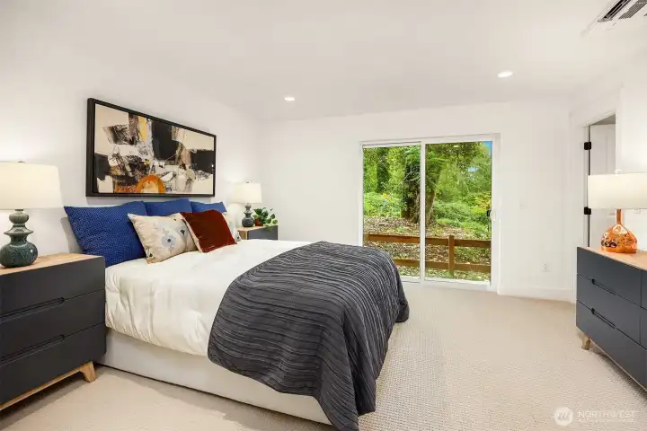 Spacious first floor bedroom with walk in closet and tranquil views of the nature preserve.   Photos are for illustrative purposes only