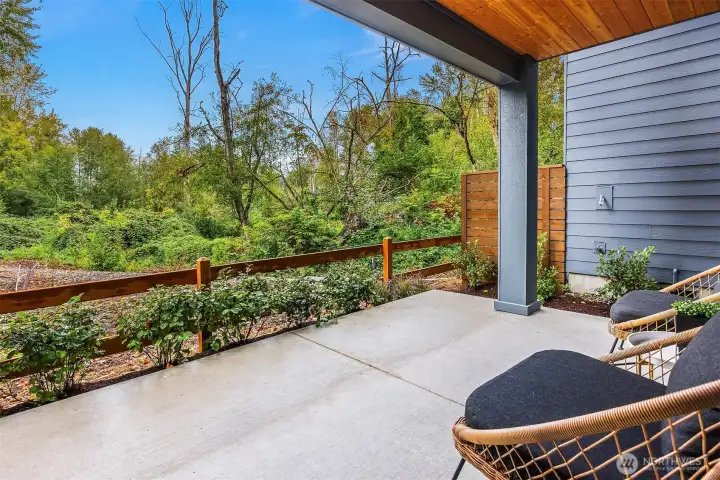 Large covered patio off with expansive views of the nature preserve   Photos are for illustrative purposes only