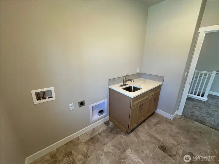 FOR ILLUSTRATION PURPOSES Laundry room includes utility sink, tile floors and window