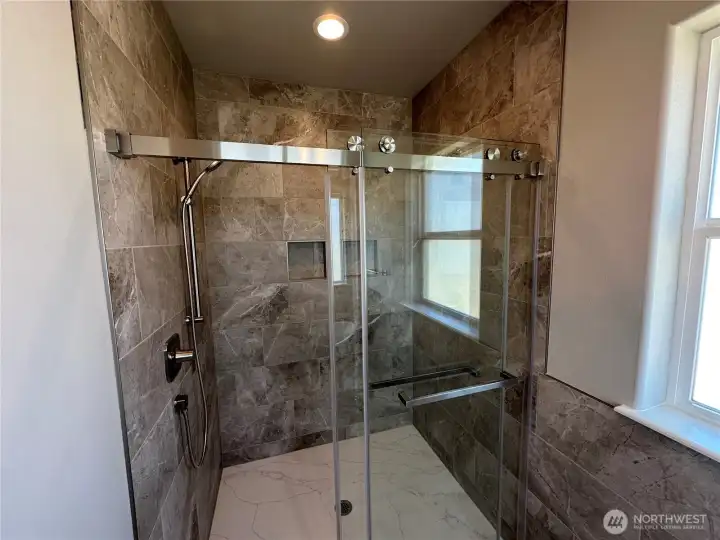 FOR ILLUSTRATION PURPOSES Spa like primary bath with free standing soaker tub, walk in tile shower , double shower heads with quartz floor, double vanity and water closet.