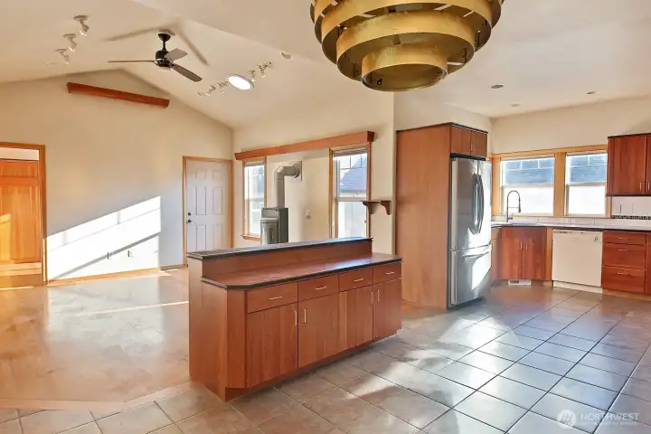 The entry, dining, hall, baths and primary suite are tiled.  The primary suite and bath has in floor heat!