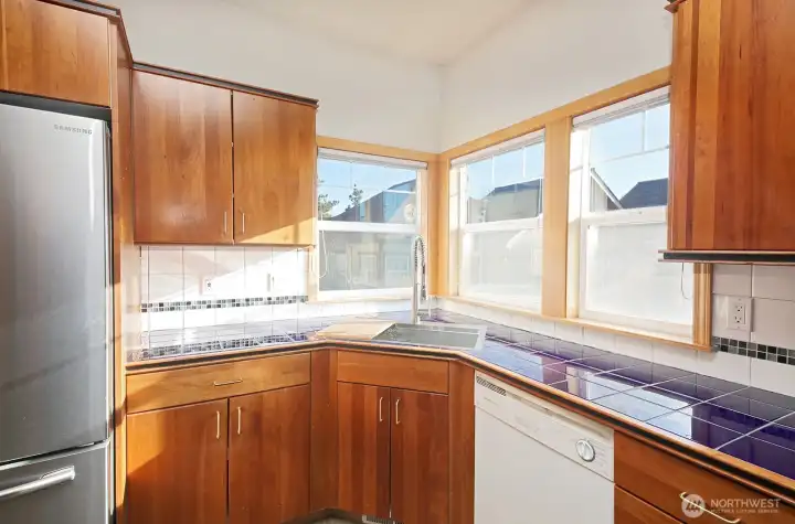 Corner sink with lots of windows make for a cheerful kitchen.