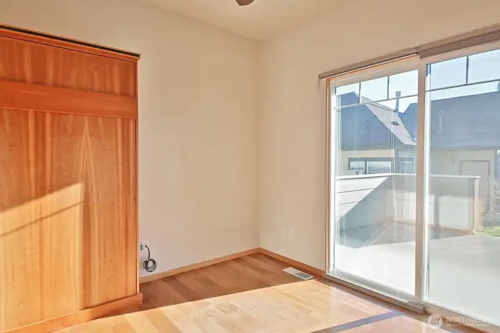 Second bedroom with slider to the back patio.