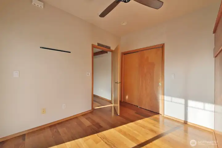 Nice sized closet in the second bedroom and all interior doors are pretty with the natural wood grain.