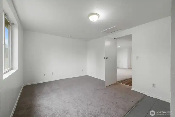 A large room- good flex as office/guest space, leads into the living room.