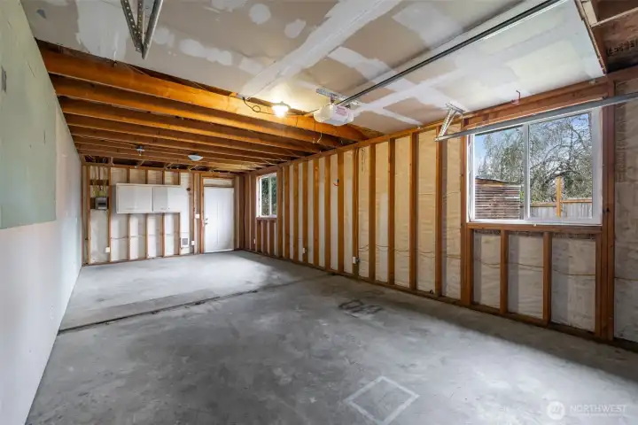Massive garage which has been plumbed and wired for potential future plans. A great workshop space or park 2 cars tandem. Good light with windows for a workspace and a door to the large backyard.