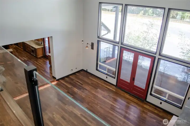 This is a view of the living room from exiting the primary suite on the second floor.