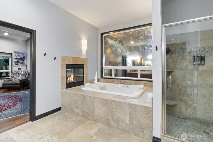 Connected seamlessly to the primary bedroom is the ensuite bathroom with heated floors.  The centerpiece of the ensuite is a luxurious jetted soaking tub to enhance your sense of calm and serenity.  Adjacent to the soaking tub is the spacious walk-in shower with new fixtures to help invigorate the senses.