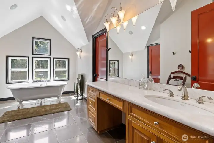 This ensuite invites you to indulge in the finer things in life.  Whether enjoying a restful night's sleep, relaxing in a sumptuous bath or simply soaking in the serene ambiance, the 2nd Primary ensuite is a testament to the art of fine living.