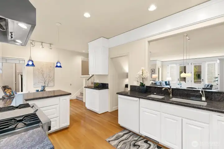 Generous proportions, granite counterops, Stainless Viking Professional 6-burner range, all overlooking an open floor-plan.