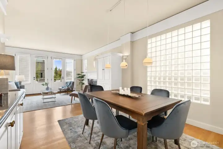 Dining room looking south to the living room and deck through French doors.