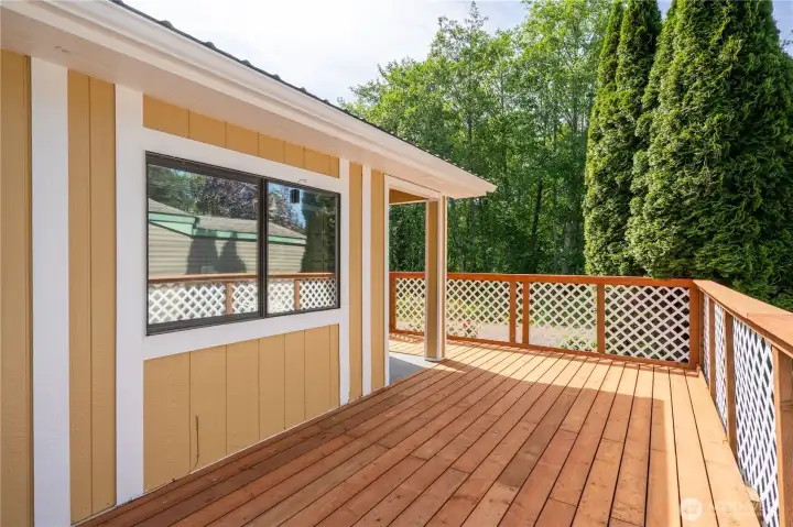 The back deck faces greenspace.
