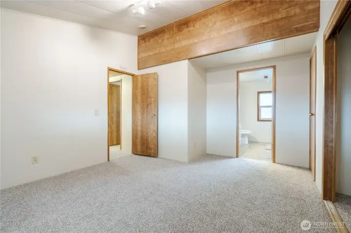 Primary bedroom with en suite bathroom.