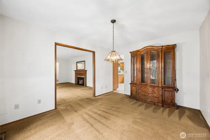 Enter in to the living room or the kitchen from this dining space.