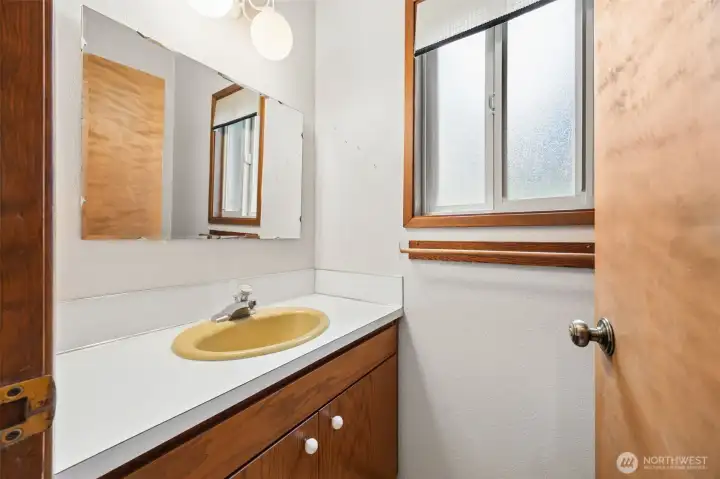 Powder room off of utility space.