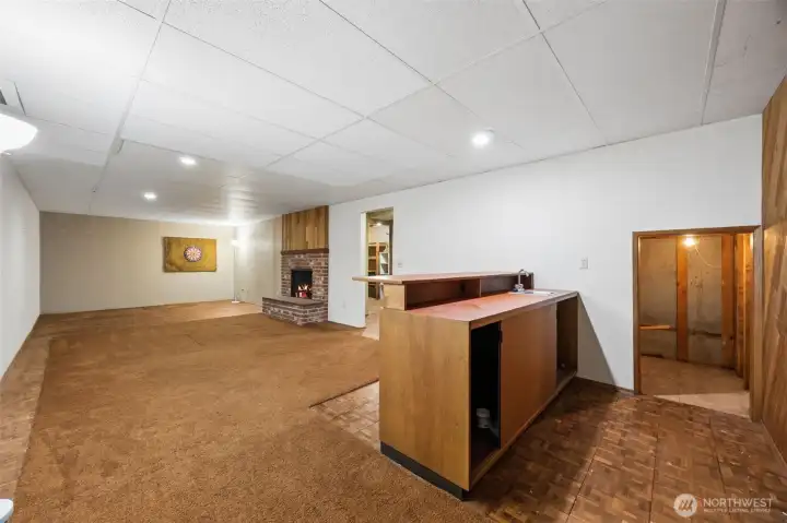 Wet bar and below stairs storage shown here. Fireplace #3 in this fun room. So many uses!