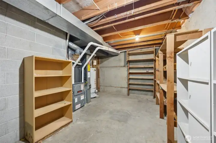 Large extra storage space in the unfinished portion of the basement. Newer high efficiency furnace and air scrubber are located in here. There is also a room that is plumbed for a 1/2 bath down here.