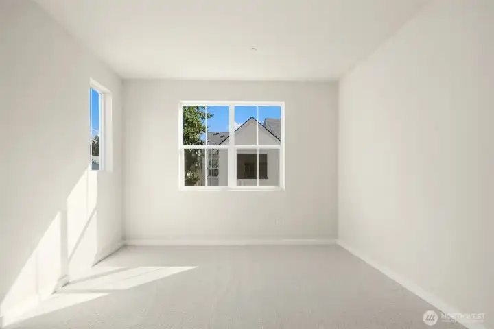 Secondary bedroom 1. Similar home shown.