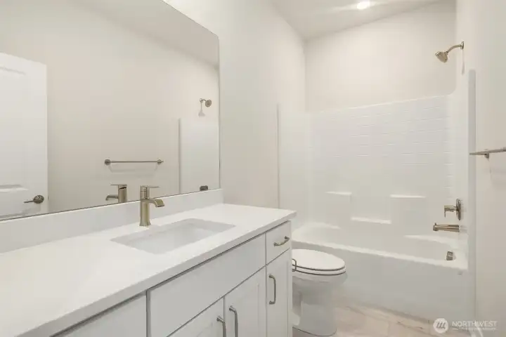 Shared bathroom. Similar home shown.