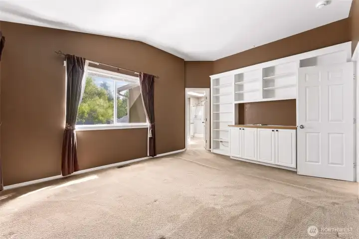 Primary bedroom suite with built in storage.