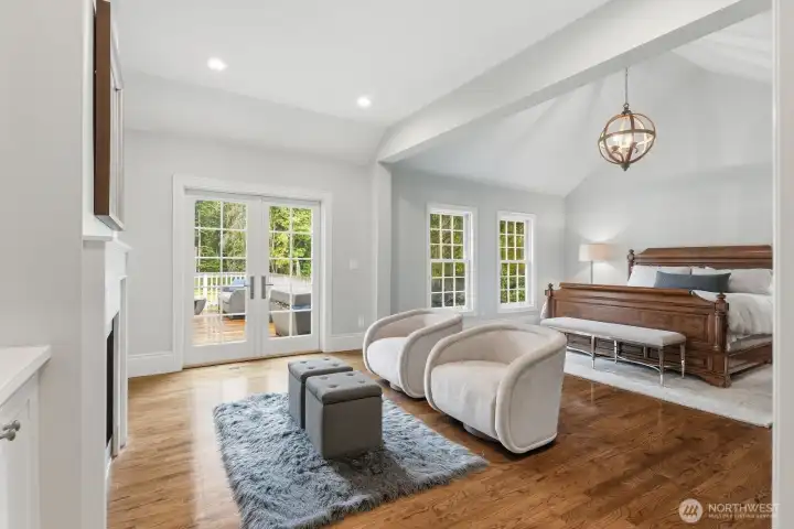 The luxurious main-level primary suite serves as a private sanctuary, complete with its own marble surround fireplace flanked with built-ins. The luxurious main-level primary suite serves as a private sanctuary, complete with its own marble surround fireplace flanked with built-ins.