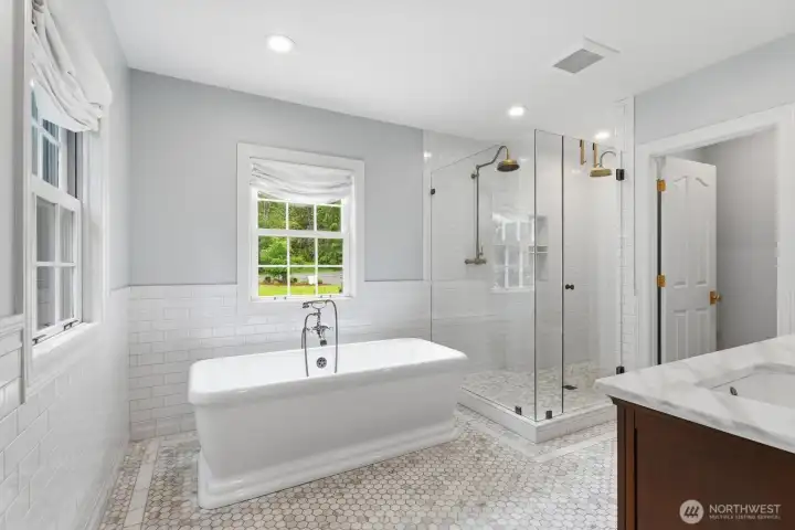 Free standing soaking tub, custom vanity and a large walk-in closet. Free standing soaking tub, custom vanity and a large walk-in closet.