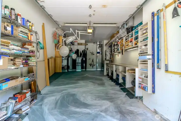 Third bay garage has great storage and a shop in back