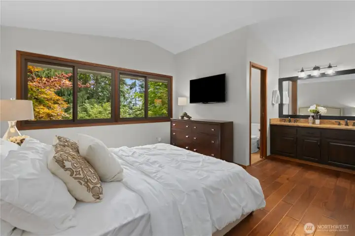 Primary bedroom features a full bath, dual-sink vanity, and a walk-in closet.