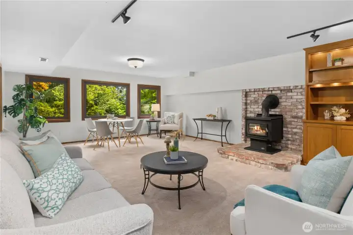 Downstairs you will find a very large second living space with a wood stove, built-ins and a wet bar.