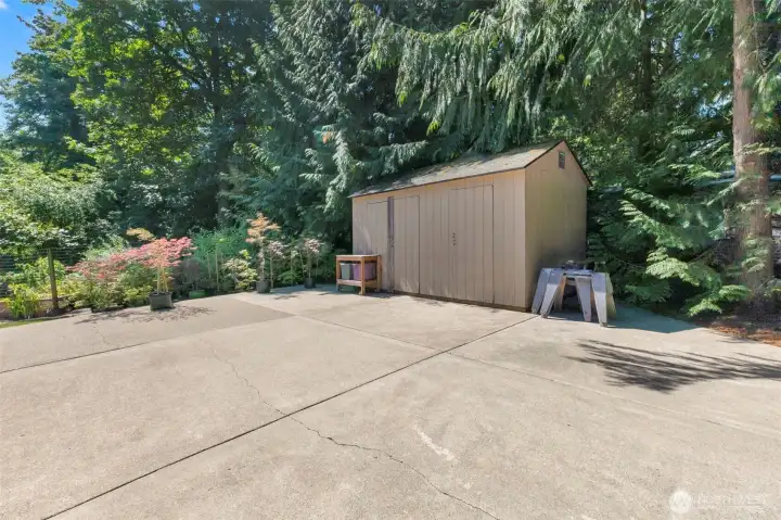 RV parking behind gate and shed.