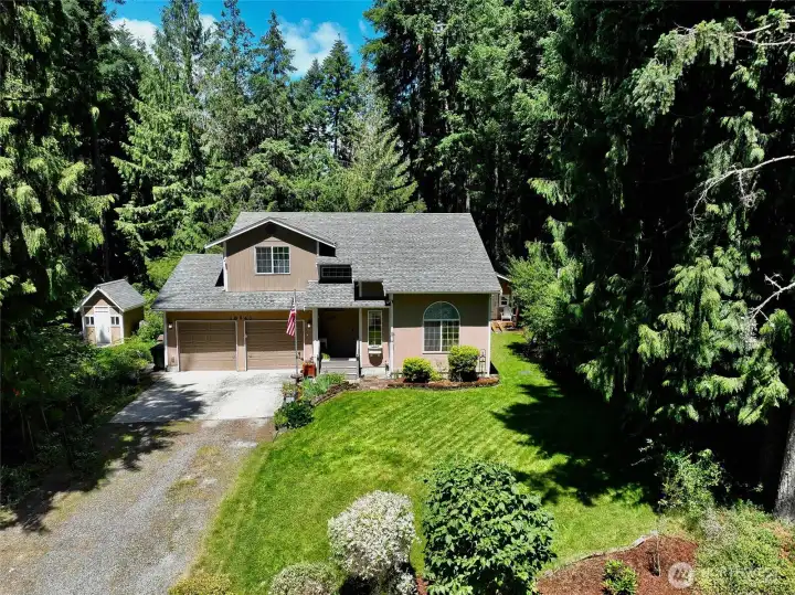 Beautifully maintained 3-bedroom, 2.5-bath home on a desirable corner lot offering comfort, functionality, and exceptional outdoor living! The landscaped .166-acre property features fruit trees, a garden with compost bins, a fire pit, an expansive back deck, & two storage sheds, including one with power and shelving. An adjacent lot with an additional shed with heater and A/C window unit is available for $45,000, creating a combined total of approximately .331 acres.Inside, you’ll find soaring ceilings and a cozy fireplace in the living room, which flows into the dining area with direct access to huge the deck. The spacious kitchen offers abundant cabinetry, generous counter space, & a breakfast bar. A convenient half bath and under-stair w/hidden storage complete the main level.The oversized heated garage includes a utility sink, built-in shelving, and a freezer. A mini-split system provides efficient A/C, also wired for another unit and the home is generator-ready with the generator Beautifully maintained 3-bedroom, 2.5-bath home on a desirable corner lot offering comfort, functionality, and exceptional outdoor living! The landscaped .166-acre property features fruit trees, a garden with compost bins, a fire pit, an expansive back deck, & two storage sheds, including one with power and shelving. An adjacent lot with an additional shed with heater and A/C window unit is available for $45,000, creating a combined total of approximately .331 acres.Inside, you’ll find soaring ceilings and a cozy fireplace in the living room, which flows into the dining area with direct access to huge the deck. The spacious kitchen offers abundant cabinetry, generous counter space, & a breakfast bar. A convenient half bath and under-stair w/hidden storage complete the main level.The oversized heated garage includes a utility sink, built-in shelving, and a freezer. A mini-split system provides efficient A/C, also wired for another unit and the home is generator-ready with the generator
