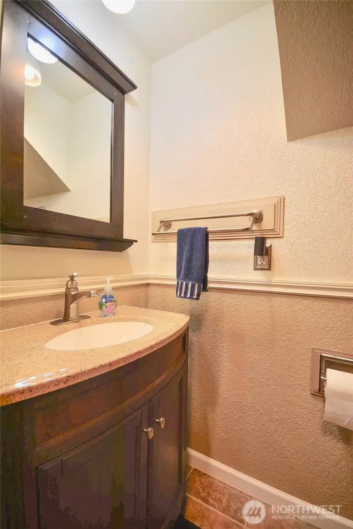 This half bath has a hidden area with private storage area. This half bath has a hidden area with private storage area.