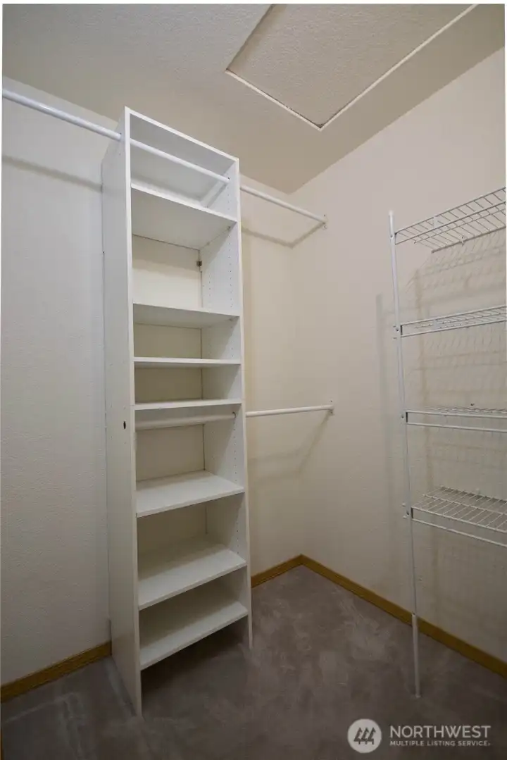Primary bedroom with closet organizers. Primary bedroom with closet organizers.