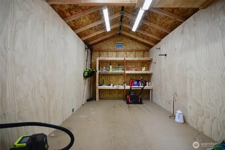 Huge shed with shelves, a cute country porch that finishes this he/shed she/shed? and blends with the exterior of the main home. Electricity installed. Huge shed with shelves, a cute country porch that finishes this he/shed she/shed? and blends with the exterior of the main home. Electricity installed.