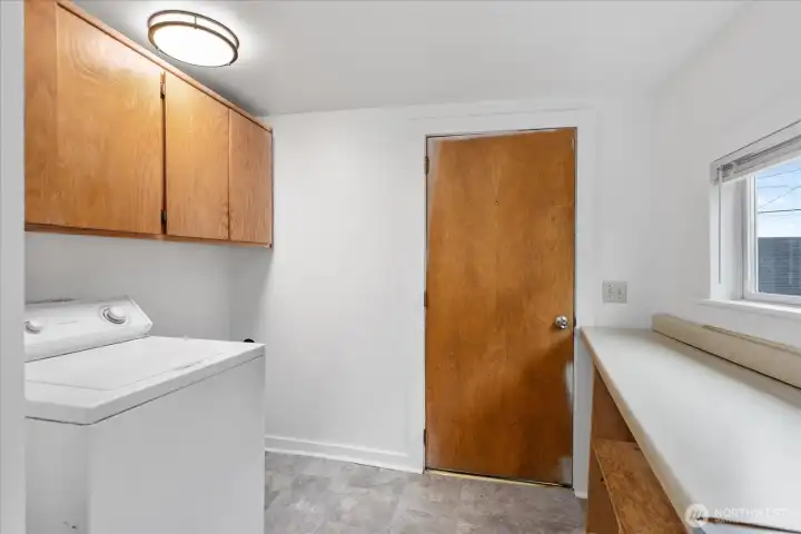 Unit 2307 laundry is just off the kitchen. Add a dryer and you are all set! Door leads to back porch. Unit 2307 laundry is just off the kitchen. Add a dryer and you are all set! Door leads to back porch.